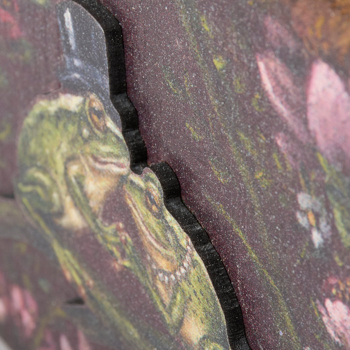 Close-up of a textured surface with a frog design and floral patterns.
