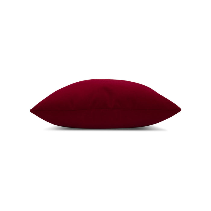 Side image of Red solid velvet pillow lumbar size for earthy patio decor