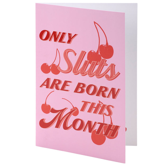 Pink card with red text and cherries on a white background