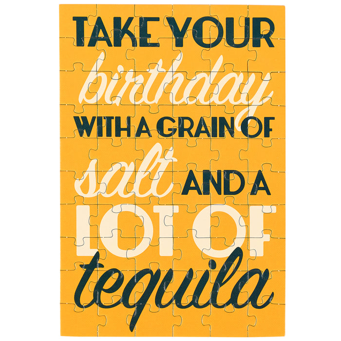 Jigsaw puzzle with humorous birthday message on a yellow background
