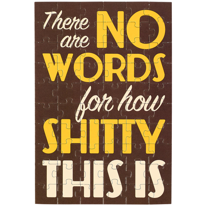 Jigsaw puzzle with text 'There are no words for how shitty this is' on a brown background