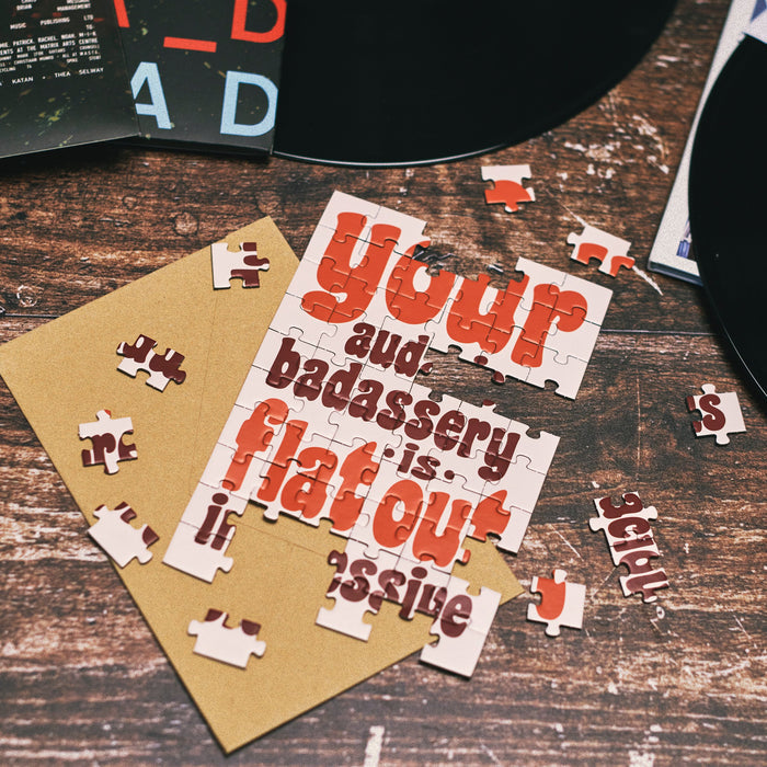 Jigsaw puzzle with funny quote on a wooden surface